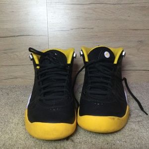 Black yellow and black checkered Jordans
